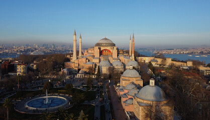 Obraz premium Aerial drone shot of Byzantine-era Hagia Sophia after its conversion back into a mosque, during a blue sky day in Istanbul, Turkey.