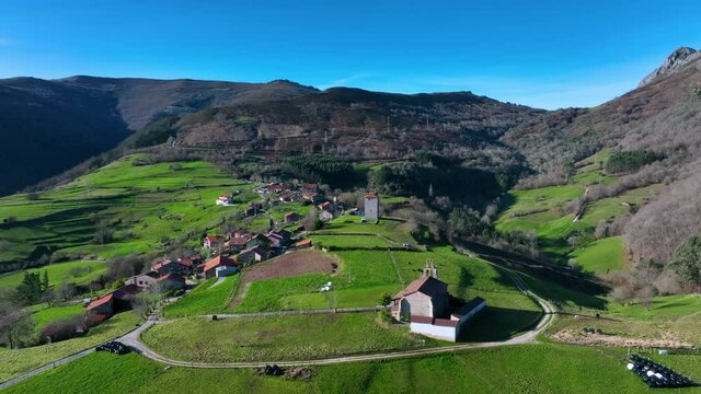Aerial view of the Tower of Rubin de Celis and the church of San Facundo in the Town of Obeso in the Municipality of Rionansa. Cantabria, Spain, Europe