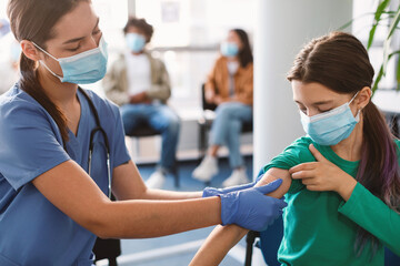 Girl Getting Vaccinated Against Covid-19, Doctor Applying Plaster