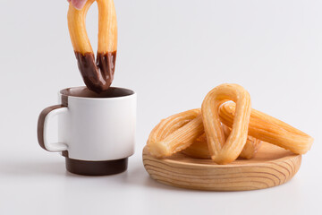 dipping churros in chocolate