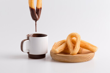dripping chocolate, dipped in churros
