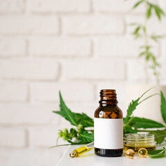 cbd oil and cannabis leaves cosmetics front view