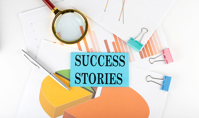 SUCCESS STORIES text on the sticker on the paper diagram