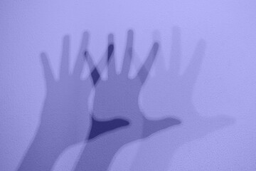 Monochrome shadows of a hand dancing to the music. Interactive exposition in science museum. Banner...