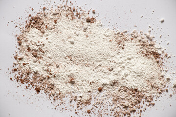 flour mixed with cocoa on isolated background, scattered powder