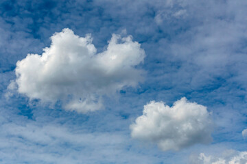 a large cumulus cloud on a background of blurry cirrus clouds as a natural background - 478844776