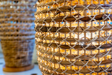 Handmade wicker lamps on wooden table. High quality photo