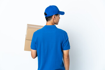 Delivery Chinese man isolated on white background in back position and looking side