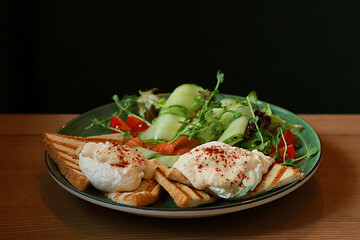 Tasty egg salad with salmon on plate     