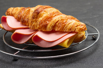 Croissant with ham and cheese.