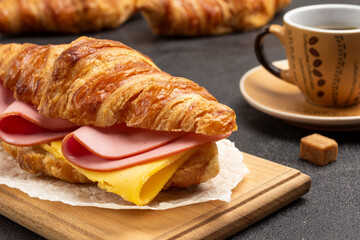 Croissant with ham and cheese.