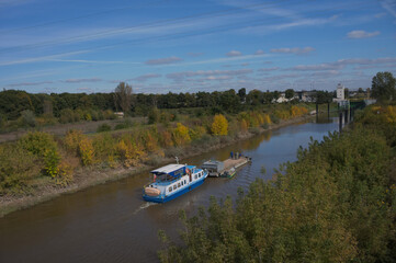 barge on the river in autumn - obrazy, fototapety, plakaty