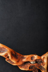 Graceful curved wood Driftwood on a black background