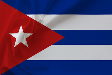 Cuba flag on waving silk background. Fabric texture.