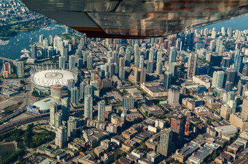 Cessna Airplane Wing Over Downtown Vancouver