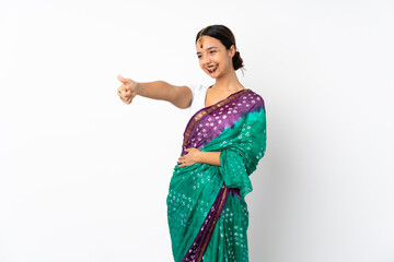 Young indian woman isolated on white background giving a thumbs up gesture