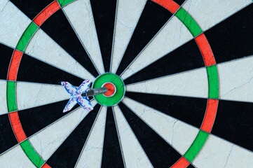 One dart stuck in the center of the target.