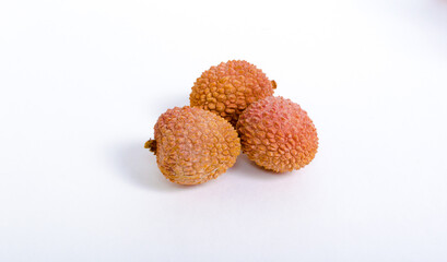 3 lychee fruit on white isolated background. Copy space. Exotic tropical fruit