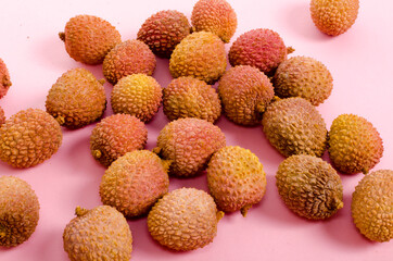 lychee on colorful pink background bright light exotic tropical fruit