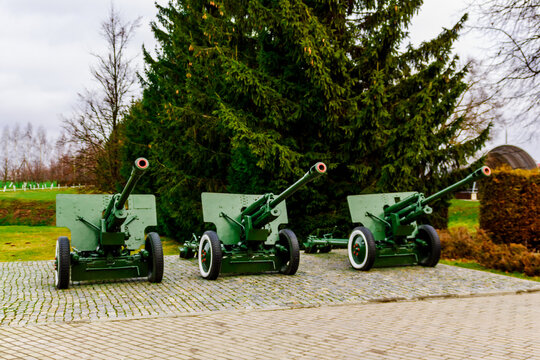 Buynichskoe field WWII memorial. Mogilev, Belarus - 28 November 2021: Three soviet anti-tank 76 mm divisional gun m1942 zis-3 as part of memorial complex of world war two on buynichskoe field.