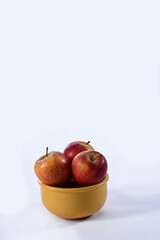 delicious red apples on the table with side view on white background.