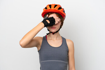 Young cyclist English woman isolated on white background covering eyes by hands. Do not want to see something
