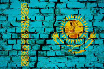 Brick wall painted in flag of Kazakhstan with crack in the middle. Symbol of revolution in Kazakhstan, massive protests, war with its own citizens