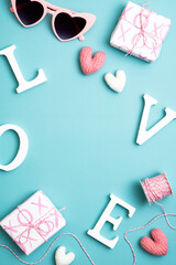 Happy Valentines Day concept. Blue vertical background with word love, gifts, sunglasses. Social...