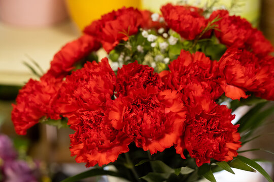 Small bouquet of red carnations flowers
