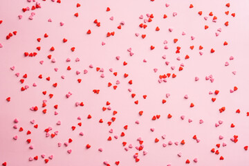 Candy confetti pattern on pink background. Happy Valentines Day concept. - obrazy, fototapety, plakaty