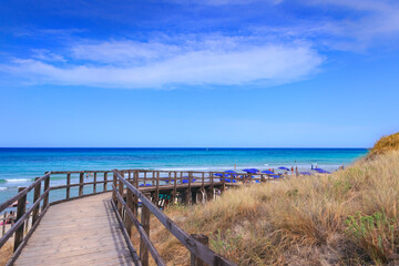 Fence between sea dunes in Apulia, Italy. The Regional Natural Park Dune Costiere (Torre Canne) covers the territories of Ostuni and Fasano along eight kilometres of coastline.