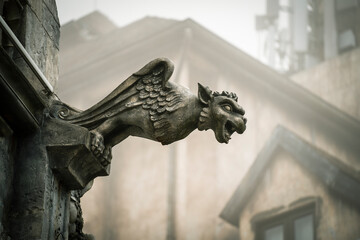 Gargoyle statue, chimeras, in the form of medieval winged monster, from the royal castle in Bana...