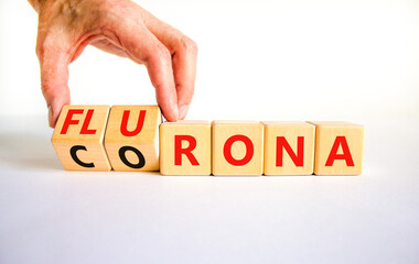 Covid-19 corona and flu flurona symbol. Doctor turns cubes and changes the word corona to flurona. Beautiful white background. Medical, covid-19 corona and flu flurona concept. Copy space.