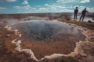 One small pond of volcanic water at Strokkur geyser area on Iceland on a beautiful sunny day....