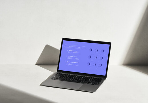 Laptop on a Concrete Surface with Sun Light and Shadows