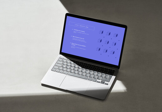 Laptop with Hard Shadow Lines on a Concrete Surface