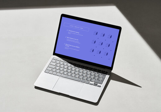 Laptop on a Concrete Surface with Shadows