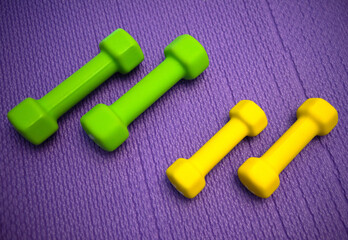 Rubber dumbbells for fitness classes - Powered by Adobe