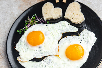 valentines day breakfast on the table scrambled eggs heart shape holiday decoration love date copy space food background