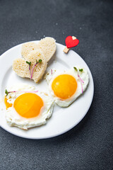 valentines day breakfast on the table scrambled eggs heart shape holiday decoration love date copy space food background