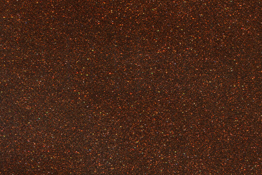 Brown glitter shiny bright texture background.
