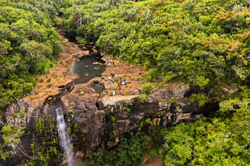 Aerial view from above of the Tamarin waterfall seven cascades in the tropical jungles of the...