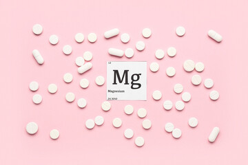 Magnesium pills on pink background