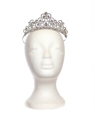 Jeweled Tiara on Mannequin Head Isolated on White © LMPark Photos