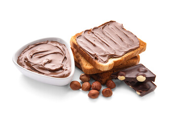 Bread with chocolate paste and hazelnuts on white background