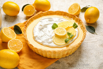 Delicious lemon tart on grunge background
