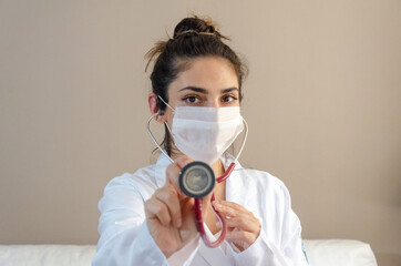 portrait of latin doctor woman with face mask and stethoscope 