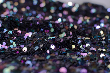 Multicolored shiny background of sequins close-up