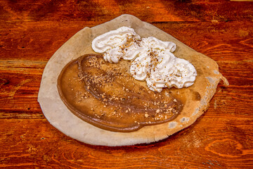 The chocolate crepe usually serves as the base of a dish or dessert, applying all kinds of sweet ingredients.