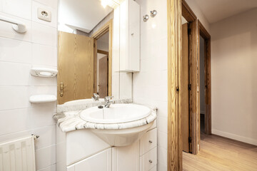 Fototapeta na wymiar Toilet with white marble countertop and sink